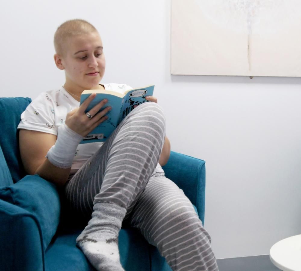 A young person reading a book