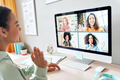 A woman hosting a virtual fundraising quiz for Teenage Cancer Trust with four other people