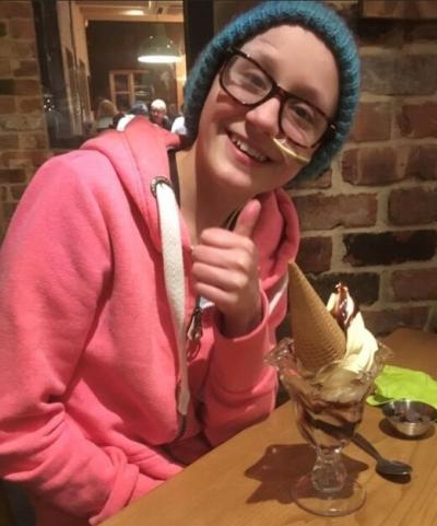 Emily with an ice cream giving thumbs up