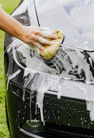 A car being washed with a sponge