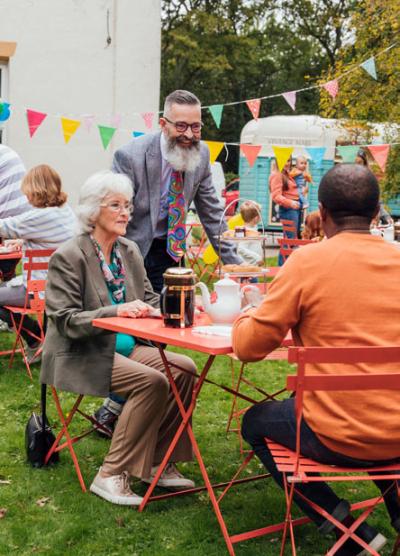 People talking at a garden party