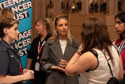 Eden Taylor-Draper with young people supported by Teenage Cancer Trust at a recent event