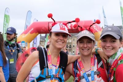 Participants smile at the finish line