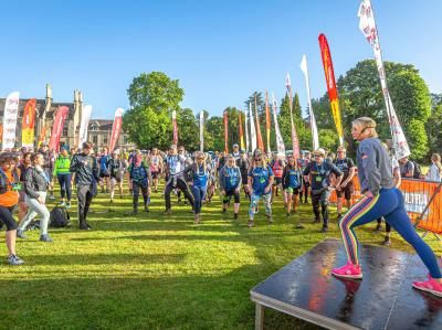 Challenge participants warm up at the start line