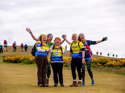 Five female participants rejoice during their challenge