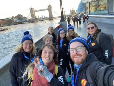 Participants take a selfie in front of Tower Bridge