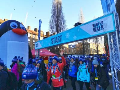 Walkers set off from the start line accompanied by a giant penguin!