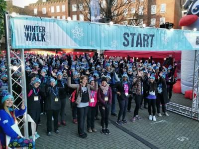 Participants smile at the start line of the challenge