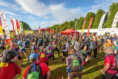 Participants warm up at the start line