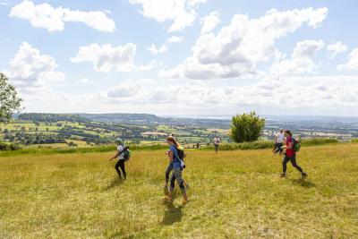 3 participants cross stunning hills in the Peak District