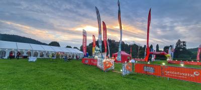 Challenge basecamp with flags and fairy lights