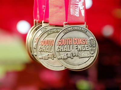 Red and gold South Coast Ultra Challenge medals