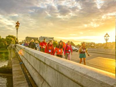 Participants cross a London bridge