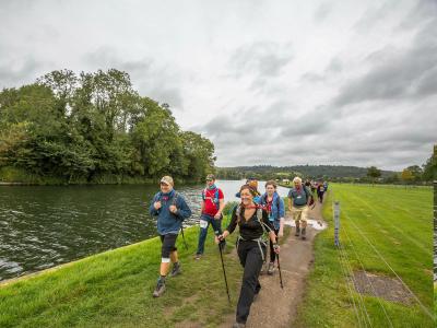 Participants walk by the Thames