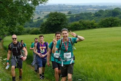 Participants climb a hill as part of the challenge