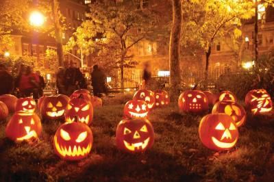 Carved pumpkins lit up by candles